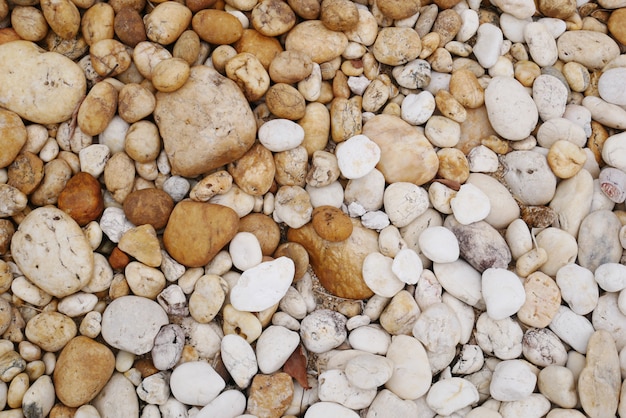 Sfondo di pietra marrone spiaggia di ghiaia