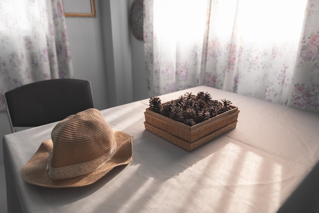 Brown pine cones on the white table