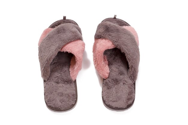 Brown and pink womens soft slippers on white isolated background Top view