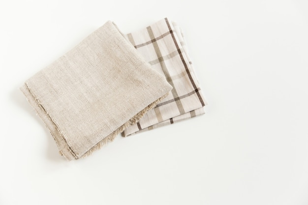 Brown plaid tablecloth and grey napkin rough cloth towel