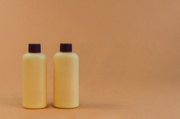 Brown plastic bottles of shampoo