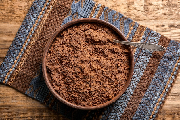 Brown plate with cocoa powder on napkin