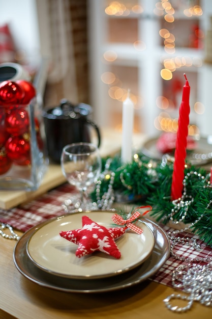 Brown plates in New Year's decoration on a wooden table