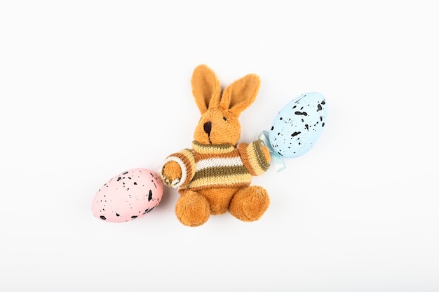 Brown plush hare with easter eggs