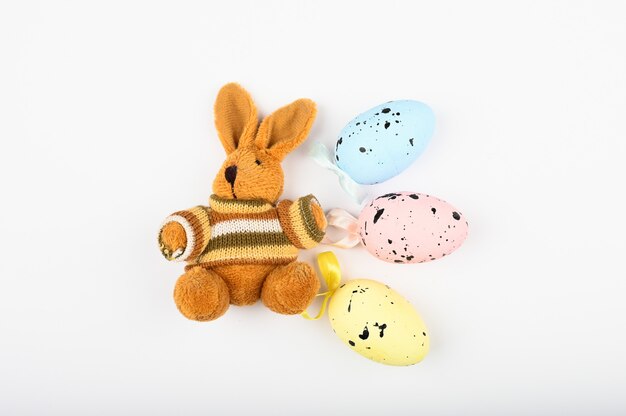 Brown plush hare with easter eggs