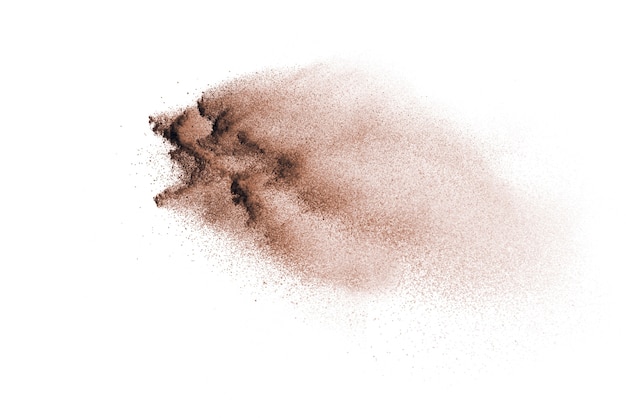 Brown powder explosion isolated on white background.