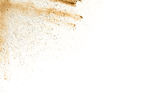 Brown powder explosion on white background.