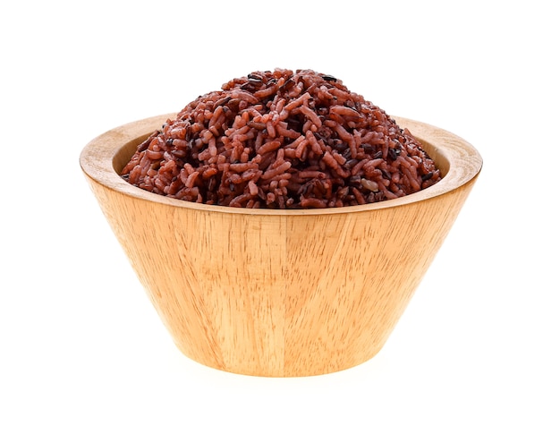 Brown rice in a bowl on white background