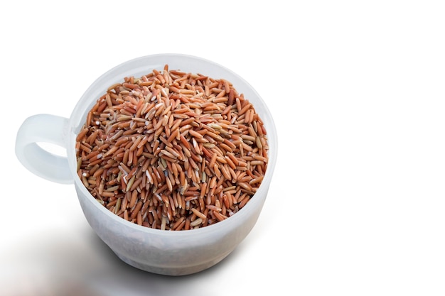 Brown rice in a measuring cup.