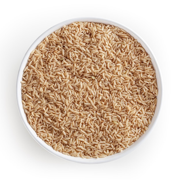 Brown rice in white bowl isolated on white background with clipping path