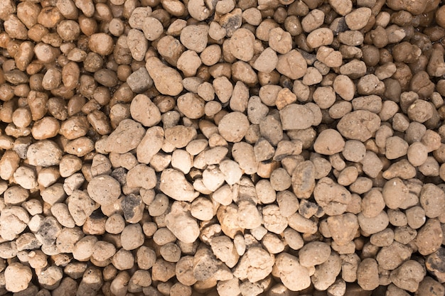 Brown river pebbles background