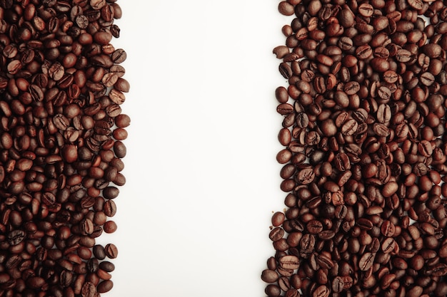 Brown roasted coffee beans isolated on white background