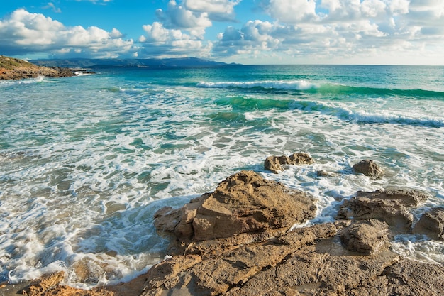 Brown rocks in Le Bombarde beach Italy