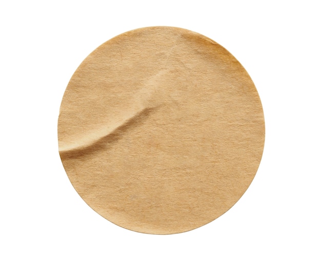 Brown round paper sticker label isolated on white background