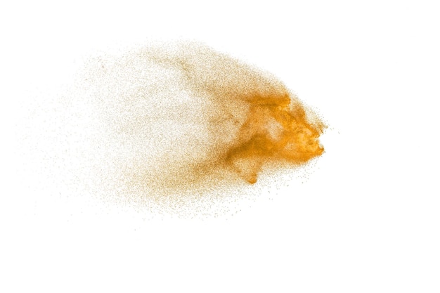 Brown sand explosion isolated on white background Abstract sand cloud backdrop