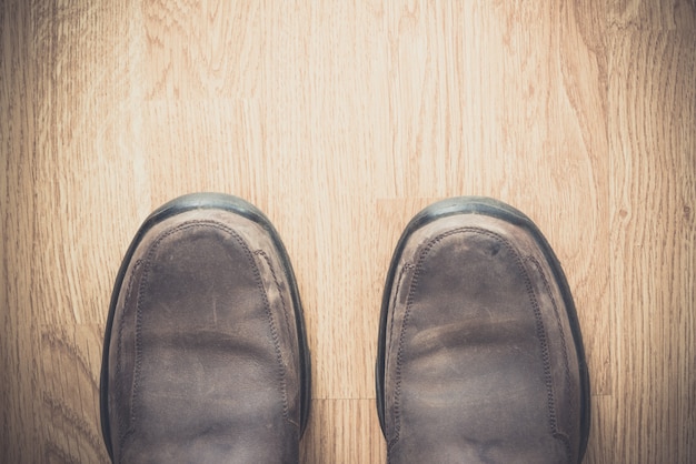 Brown shoes on wood background