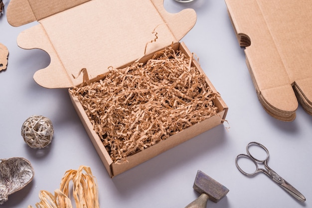 Brown shredde paper filler in cardboard box for packaging