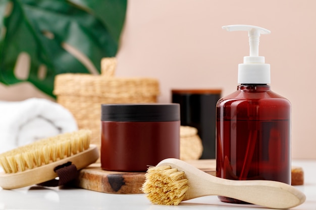 Brown skincare containers in bathroom close up photo