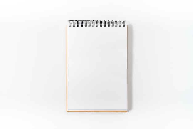 Photo brown spiral notebook isolated on white background.top view