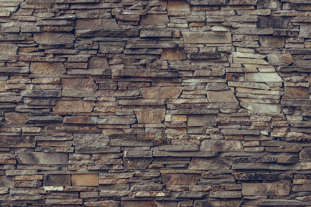 Brown stone wall, granite facade.