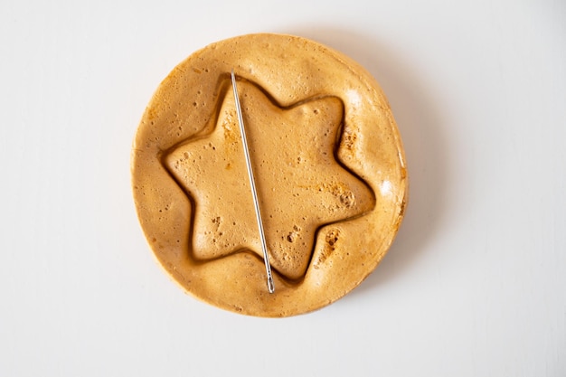 Brown sugar caramel candy cookies with a metal needle