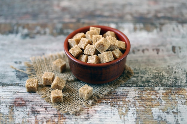 Brown sugar cubes in a bowl.