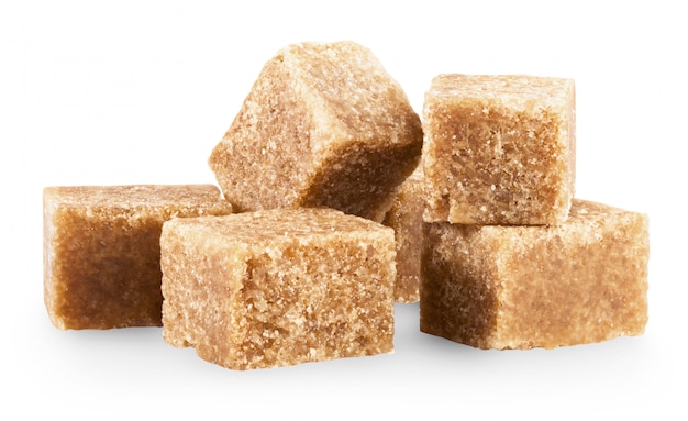 Brown sugar cubes isolated on white