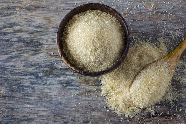 brown sugar heap and wooden spoon