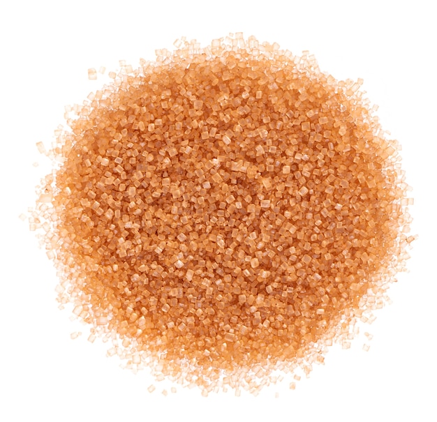 Brown sugar isolated on white background heap of cane sugar crystals top view