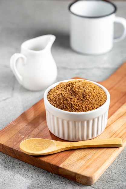 Brown sugar in ramekin on the table