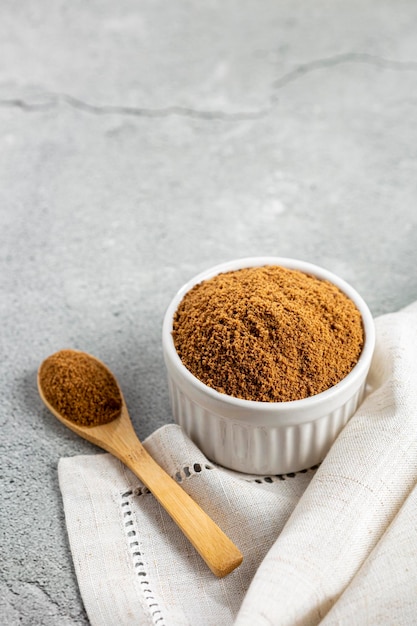 Brown sugar in ramekin on the table