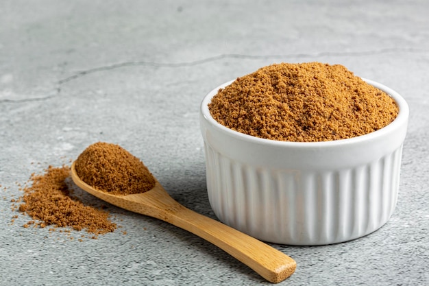 Brown sugar in ramekin on the table