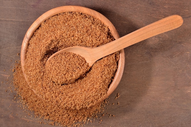 Brown sugar in a wooden bowl