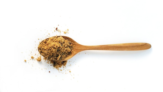 Brown sugar in wooden spoon