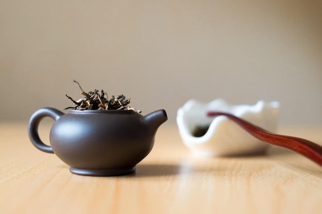 Brown teapot and tea box on the table