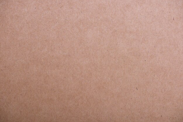 Brown textured cardboard background.