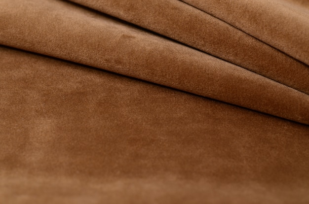 Brown velour textile sample. fabric texture background