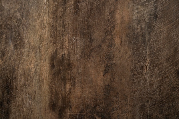 A brown wall with a black and brown textured surface and the word " water " on the bottom.