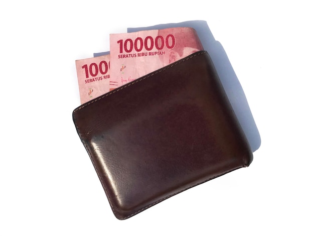 Brown wallet and Two hundred thousand Indonesian money Indonesian rupiah wallet and money on a whit