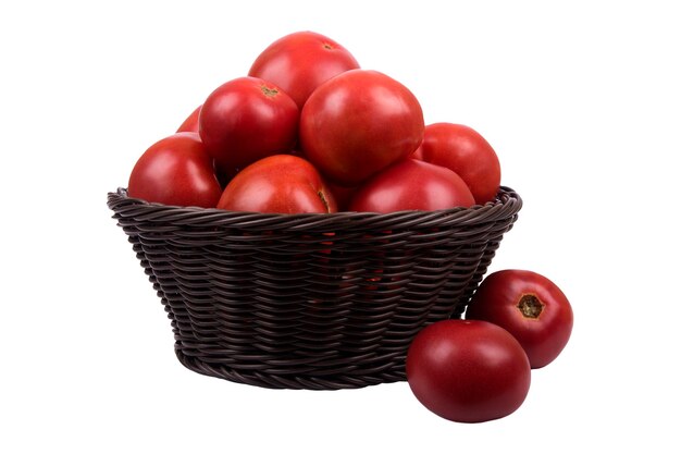 Brown wattled basket with red ripe tomatoes isolated on white background