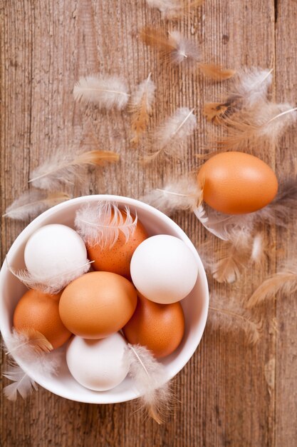 Brown and white eggs in a bowl