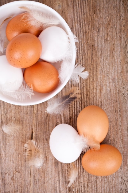 Brown and white eggs in a bowl