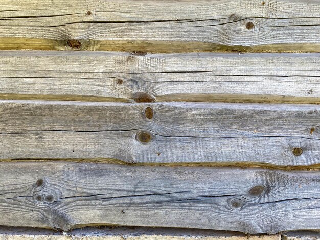 Brown wood texture of natural wood from horizontal planks with knots The background