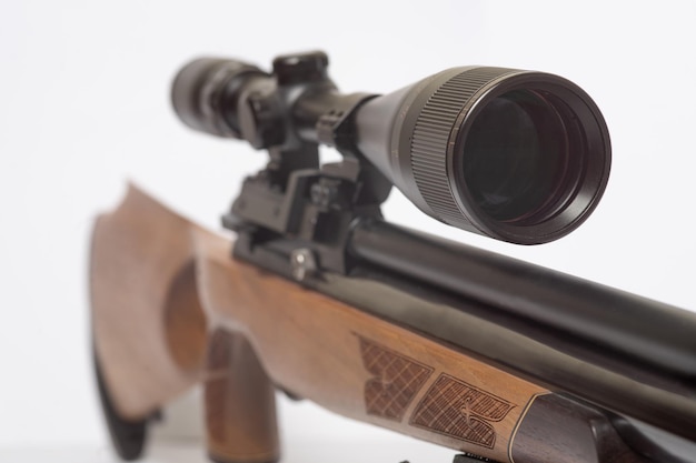 Photo the brown wooden air rifle for shooting range with optical sight isolated on white background