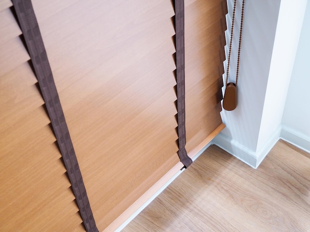 Above of Brown wooden blinds on windows of rooms inside house