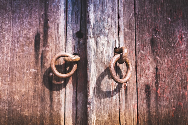 brown wooden old metal door handle on old wooden door nocker