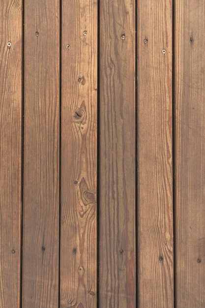 Foto foto verticale di struttura consumata delle stecche di legno marroni