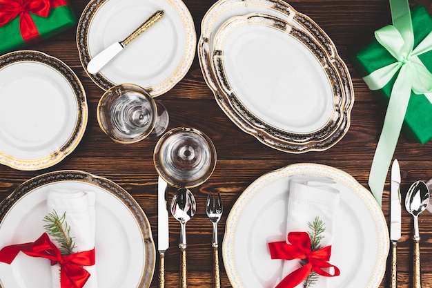 Brown wooden table with beautiful christmas table setting