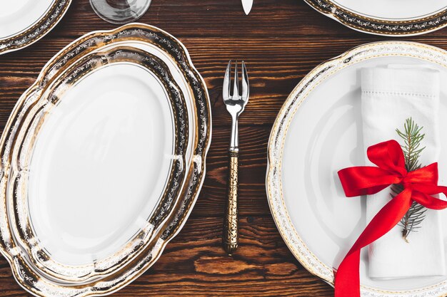 Brown wooden table with beautiful Christmas table setting