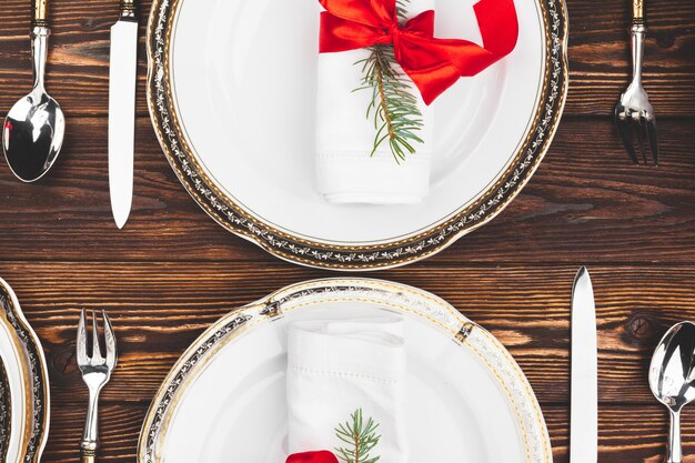 Brown wooden table with beautiful Christmas table setting